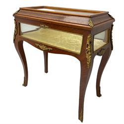 Mid-to-late 20th century French design Kingwood and walnut bijouterie cabinet, enclosed by cavetto moulded hinged lid with gilt metal foliage cast mounts and checkered stringing, on cabriole supports mounted by ornate cartouche castings and scrolled foliate terminal caps, lined in gold foliate pattern fabric and glazed with bevelled glass