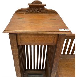 Victorian carved oak hall bench, raised shaped pediment carved with acorns and oak leaves, hinged lid over stick and umbrella stand with drip tray, fitted with a series of vertical rails, hinged and panelled box seat, carved with grotesque masks 