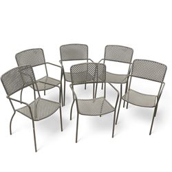 Wrought metal circular garden table, and six lattice back chairs