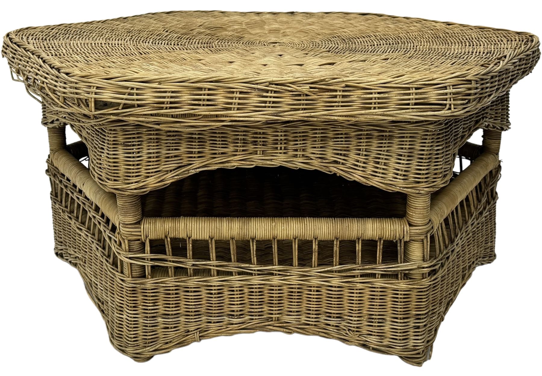 Mid-20th century hexagonal wicker coffee table, featuring woven top with pattern that radiates from the centre, lower shelf for additional storage, supported by interwoven wicker legs