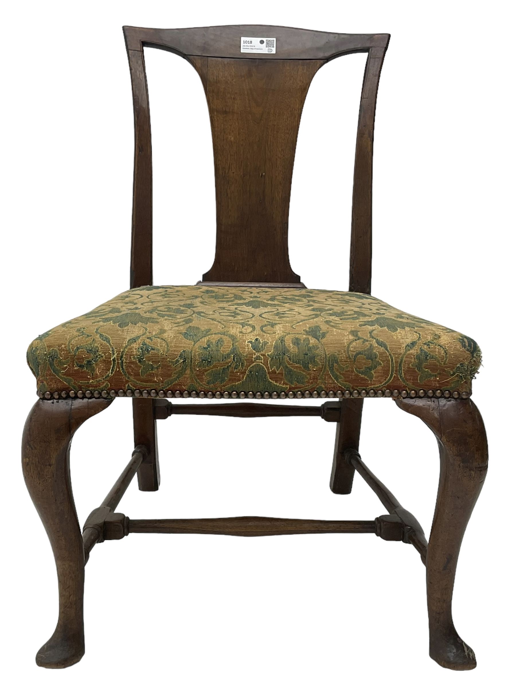 Mid-18th century mahogany side chair, shaped cresting rail over tapered back splat, seat upholstered in green and camel foliate patterned fabric with stud work border, raised on cabriole supports united by swell-turned stretchers