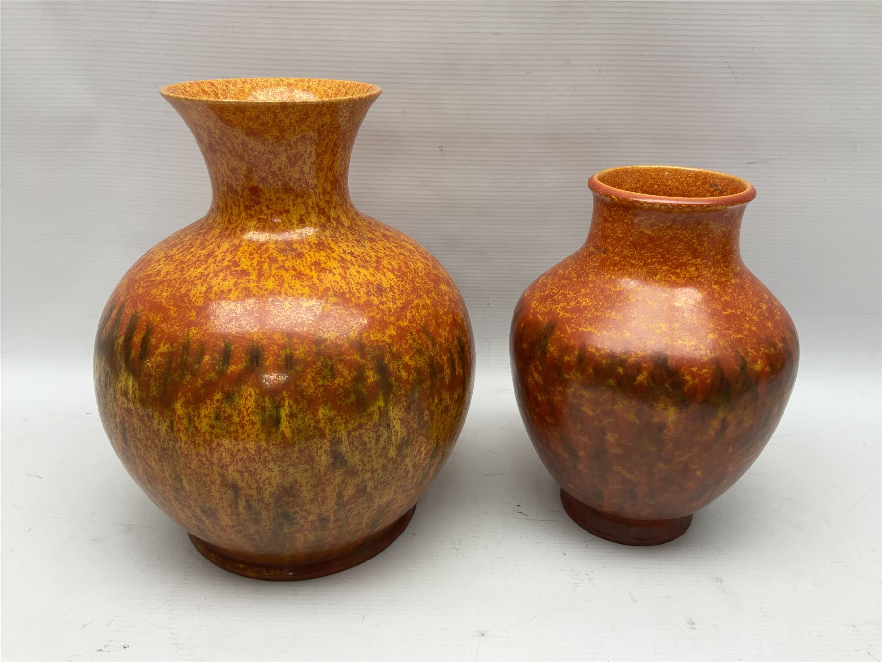 Two Pilkington's Royal Lancastrian vases of baluster form decorated in orange Vermillion, larges H27cm