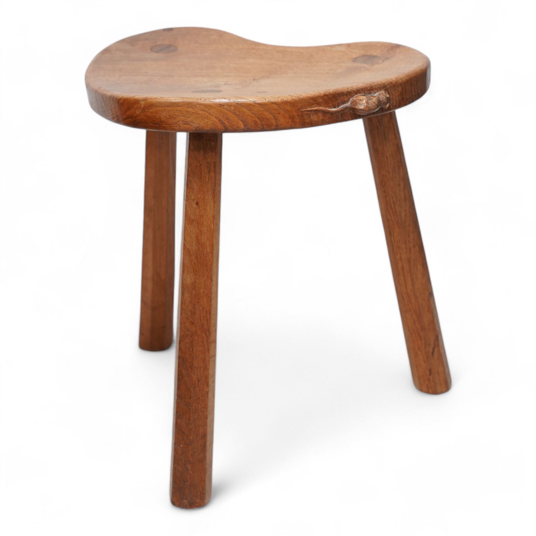 Mouseman - oak kidney-shaped stool, on three tapered octagonal supports, carved with moues signature, by the workshop of Robert Thompson, Kilburn 