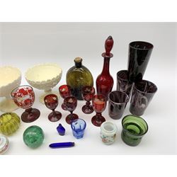 A group of Victorian glassware, to include Ruby flashed decanter and six glasses, decanter H25cm, five further drinking glasses with green bowls, a dump paperweight, and miniature painted milk glass teawares, two slag glass pedestal bowls, four slag glass tumblers, plus a small selection of later glassware, comprising a moulded glass bottle detailed 'Success to the Railroad', and an amber glass Isle of Man 1892 exhibition compressed tumbler. 