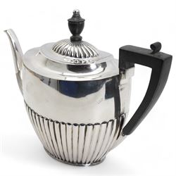 Late Victorian silver oval teapot with ebonised handle and lift, half body reeded decoration and presentation inscription Sheffield 1895 Maker Atkin Bros.