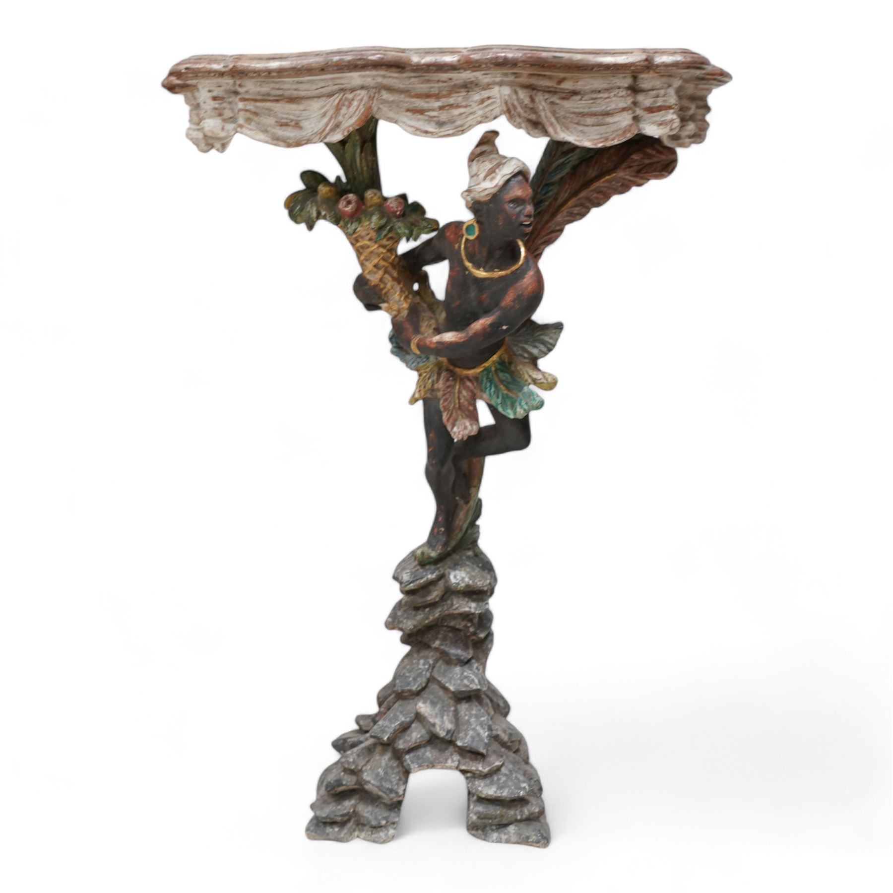 Pair of Venetian 18th century design figural polychrome painted console or torchère tables, green marbled demi-lune top with moulded scalloped edge, over a carved frieze in the form of white swags, the figural pedestal bearing a cornucopia, and dressed in a white turban and ostrich feather skirt over a down-scrolling acanthus support, standing upon a naturalistic rock carved base