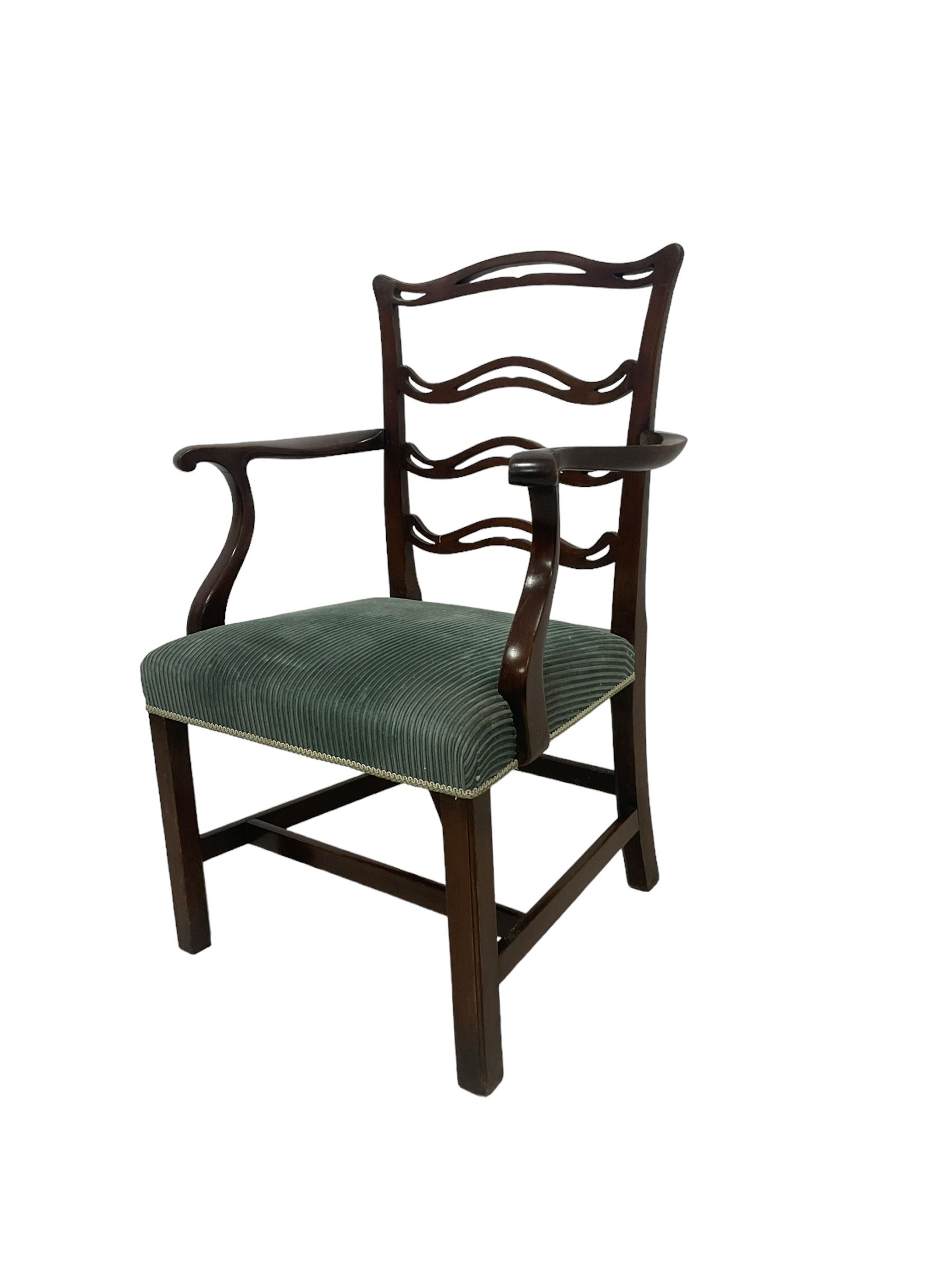 Set of twelve (10+2) Chippendale revival stained beech dining chairs, pierced waived ladder backs with over-stuffed over seats, on square moulded supports joined by stretchers