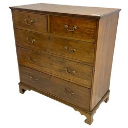 George III oak straight-front chest, fitted with two short over three long graduating drawers, lower moulded edge over shaped bracket feet