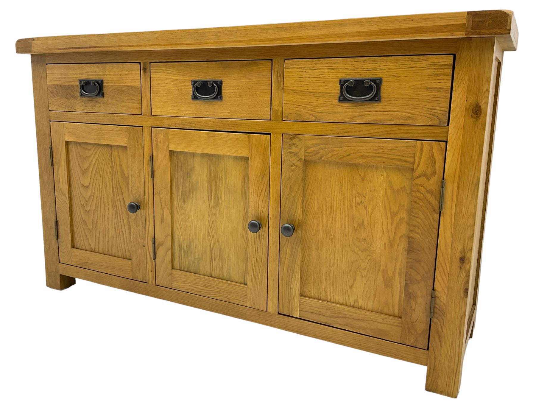 Contemporary light oak sideboard, fitted with three drawers over three panelled cupboards enclosing shelving, on square supports