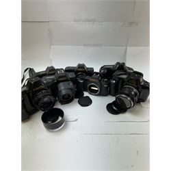 Seven Canon SLR camera bodies, comprising T50 serial no. 2011593, T70 serial no. 1319312, in carry case, two T80 examples, serial nos. 242362 & 256560, one with a Canon AC 35-70mm 1:3.5-4.5 zoom lens, and three T90 examples, serial nos. 1174363, 1005979 & 1019836, one example with a Canon FD 55mm 1:12 lens and one with a Canon FD 50mm 1:1.4 lens, one example with box