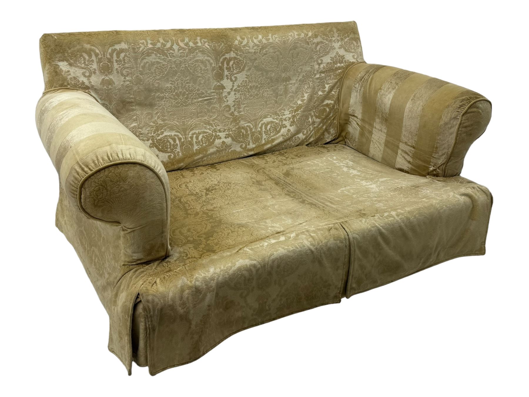 Contemporary two-seat sofa, upholstered in damask fabric with a pale gold floral pattern, rolled arms, loose back and seat cushions, on matching skirted base with concealed castors