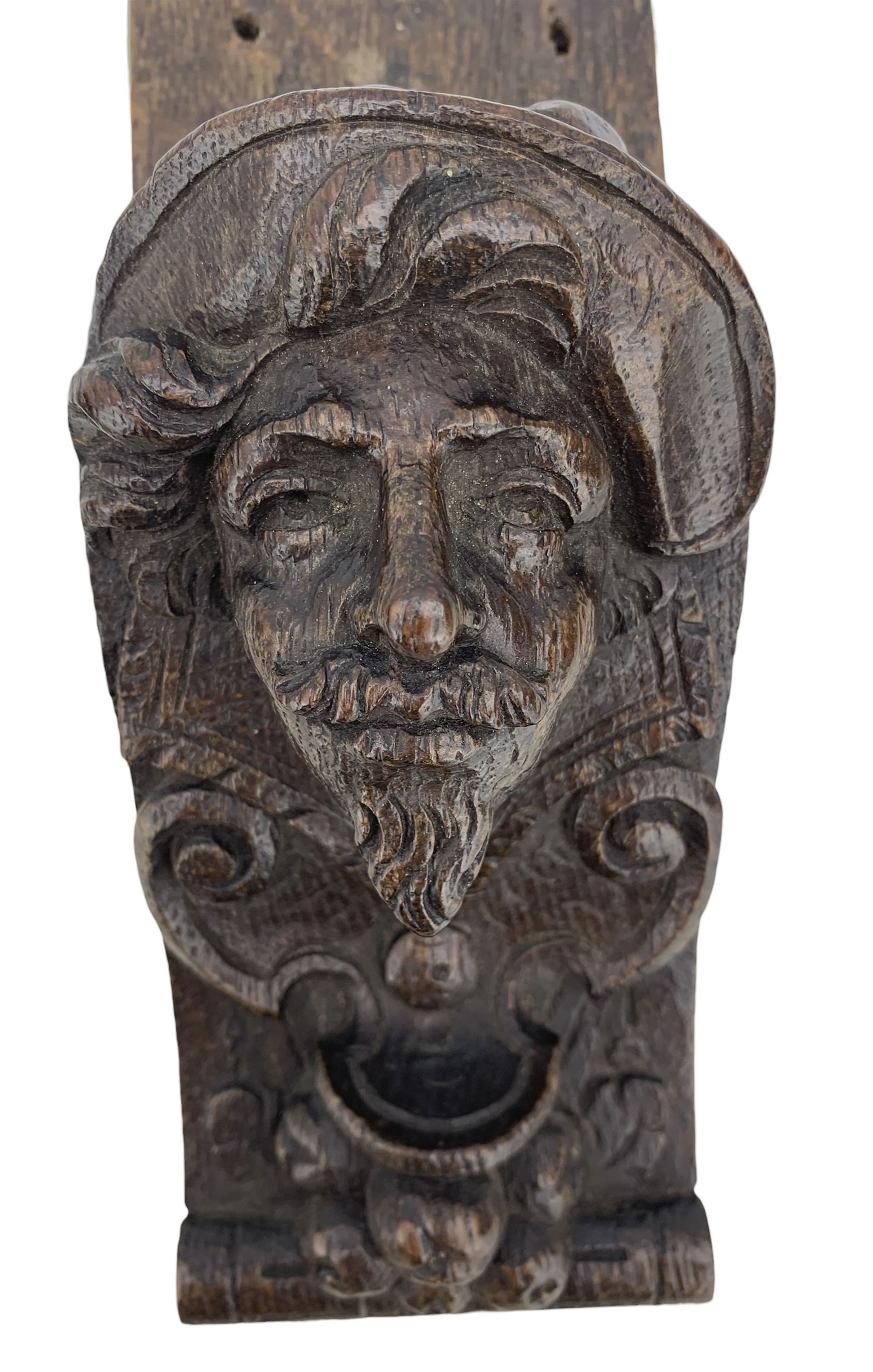 Pair of Victorian figural carved oak corbels, modelled as male and female masks, with scroll and fruit details, H22cm x W8.5cm 