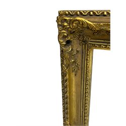 Regency revival style gilt framed oval mirror, the frame with laurel swags topped with urn and flame finial, beaded chain and ram's head motifs, bevelled glass pane; three additional gilt framed mirrors to include one oval and two rectangular (4)