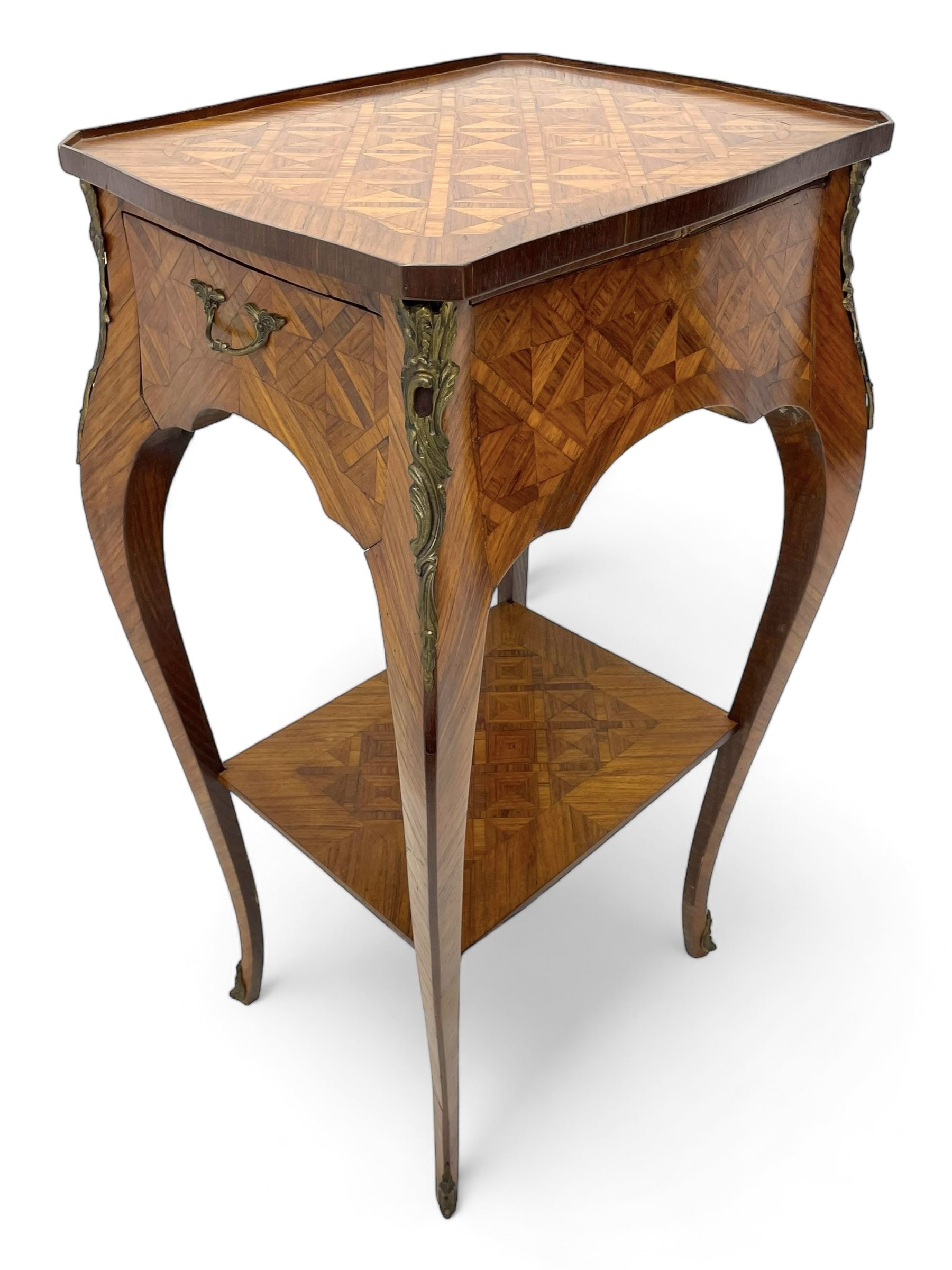 Late 20th century French design Kingwood lamp table, shaped form with geometric parquetry inlaid top within band and raised lip, fitted with single drawer and slide, on cabriole supports united by undertier, decorated with ornate cast gilt metal mounts and terminal caps 