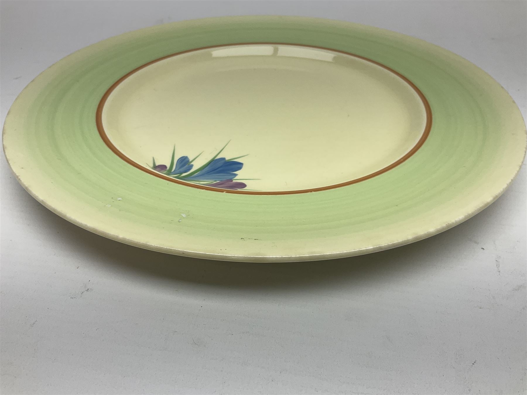 Clarice Cliff trio and plate in Spring Crocus pattern, all with printed mark beneath, plate D25cm 