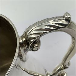 George II silver tankard, of waisted baluster form with acanthus capped C scroll handle, the body engraved with a lion rampant, upon a circular spreading foot, hallmarked Gabriel Sleath & Francis Crump, London 1754, H13cm