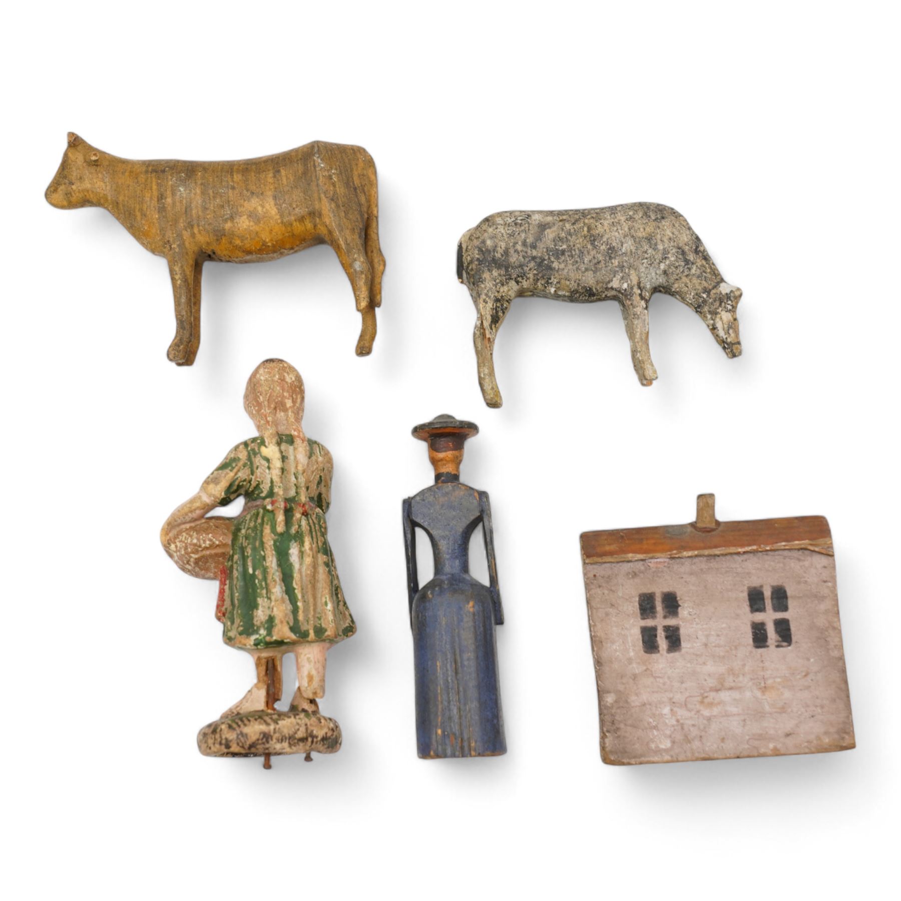 19th century German carved and painted figures including a female figure and two cows, probably from Erzgebirge Noah's Ark, a similar period carved and painted wooden house and an Elastolin figure (5)