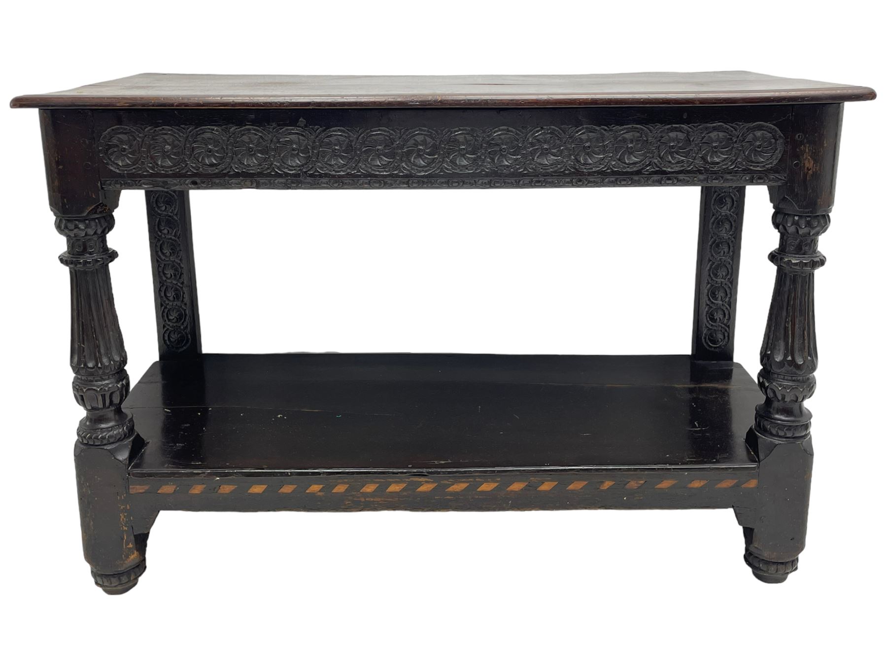  17th century oak buffet or side table, moulded rectangular top over guilloche carved frieze rails and rear upright supports, turned and flute carved front supports united by under tier