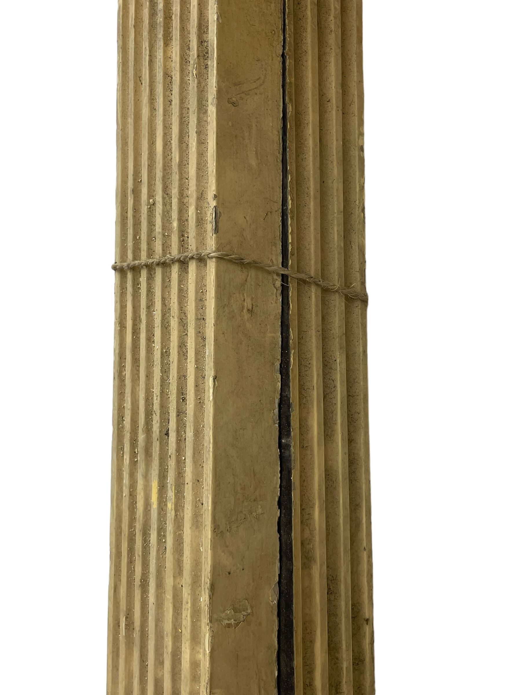 Three 19th century wood and gesso Composite order architectural architraves - curled acanthus leaf capitals over fluted shafts, the bases decorated with guilloche moulding over trailing laurel leaf branches, one half columns, one L-shaped rectangular pilaster and one full column, the largest - H204cm