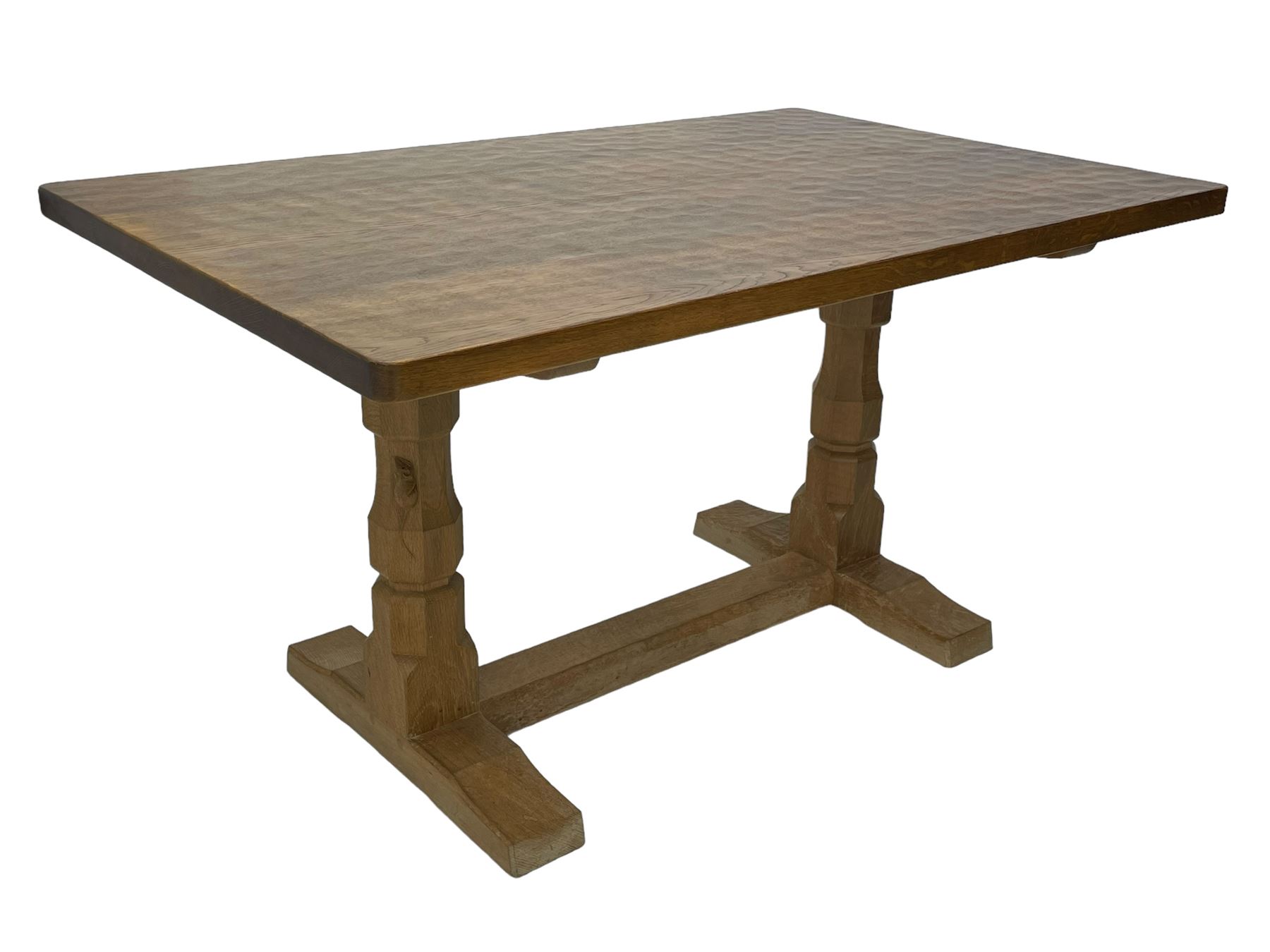 Mouseman - oak dining table, rectangular adzed top with rounded corners, octagonal pillar supports on sledge feet united by floor stretcher, carved with mouse signature, by the workshop of Robert Thompson, Kilburn