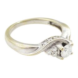 18ct gold round brilliant cut diamond ring, central diamond flanked by groups of smaller diamonds, hallmarked, principal diamond weight approx 0.25 carat