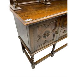 Jacobean Revival oak dresser, projecting moulded cornice over arcade carved frieze and panelled back, on spiral turned supports, moulded rectangular top over two cupboards and two drawers, on spiral turned supports united by moulded stretchers 