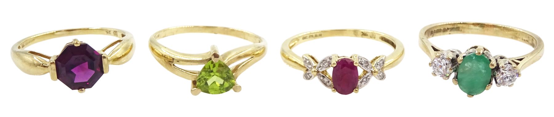 Four 9ct gold stone set rings including ruby and diamond and peridot, all hallmarked