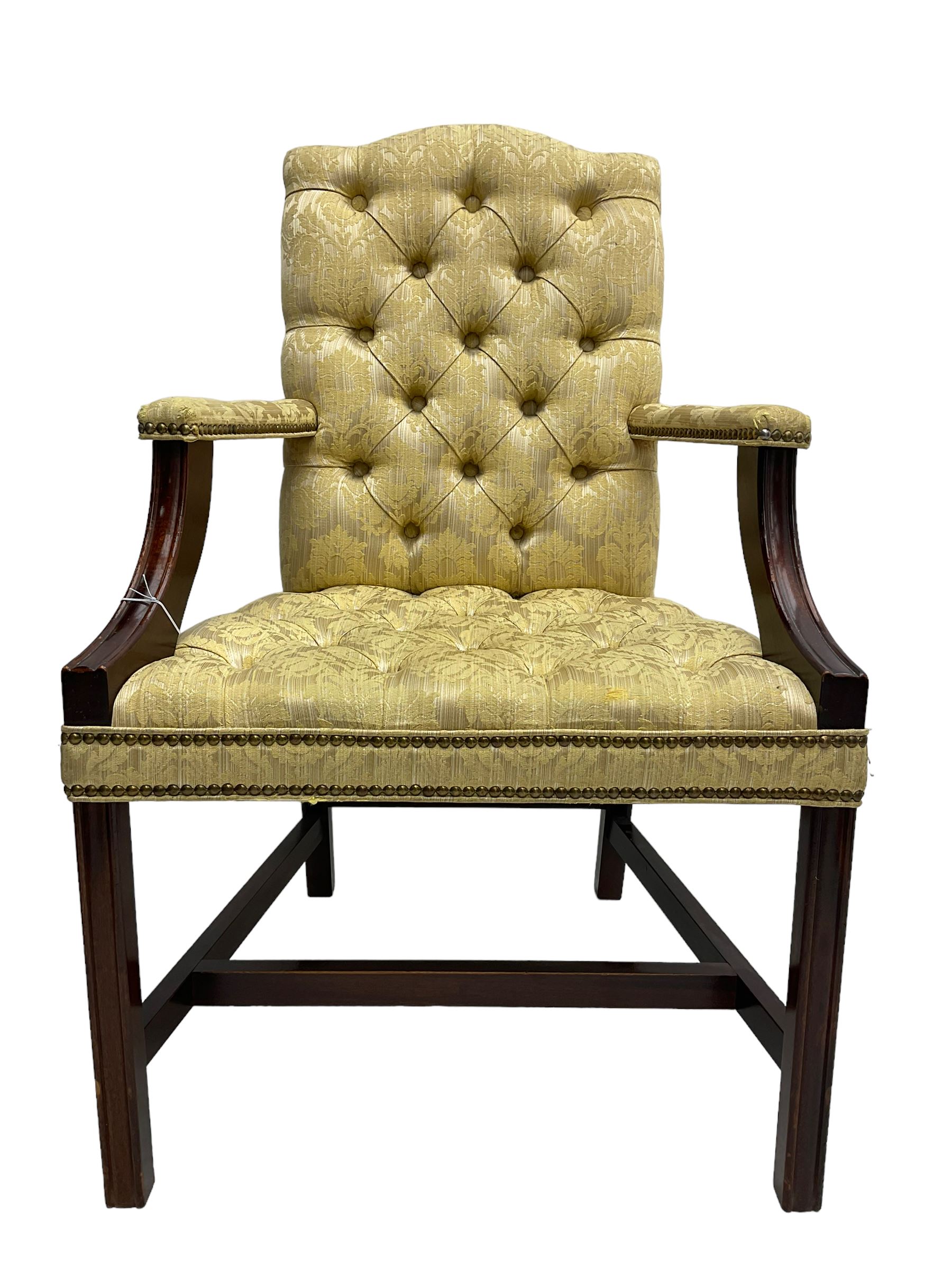 Georgian design mahogany framed Gainsborough open armchair, upholstered in pale gold buttoned fabric with floral pattern, on square moulded supports united by plain stretchers 