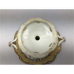Victorian porcelain comport, the shaped dish with pierced rim and twin handles, decorated in the manner of Coalport with floral swags, buff border, and heightened with gilt, not including handles H18cm D30cm