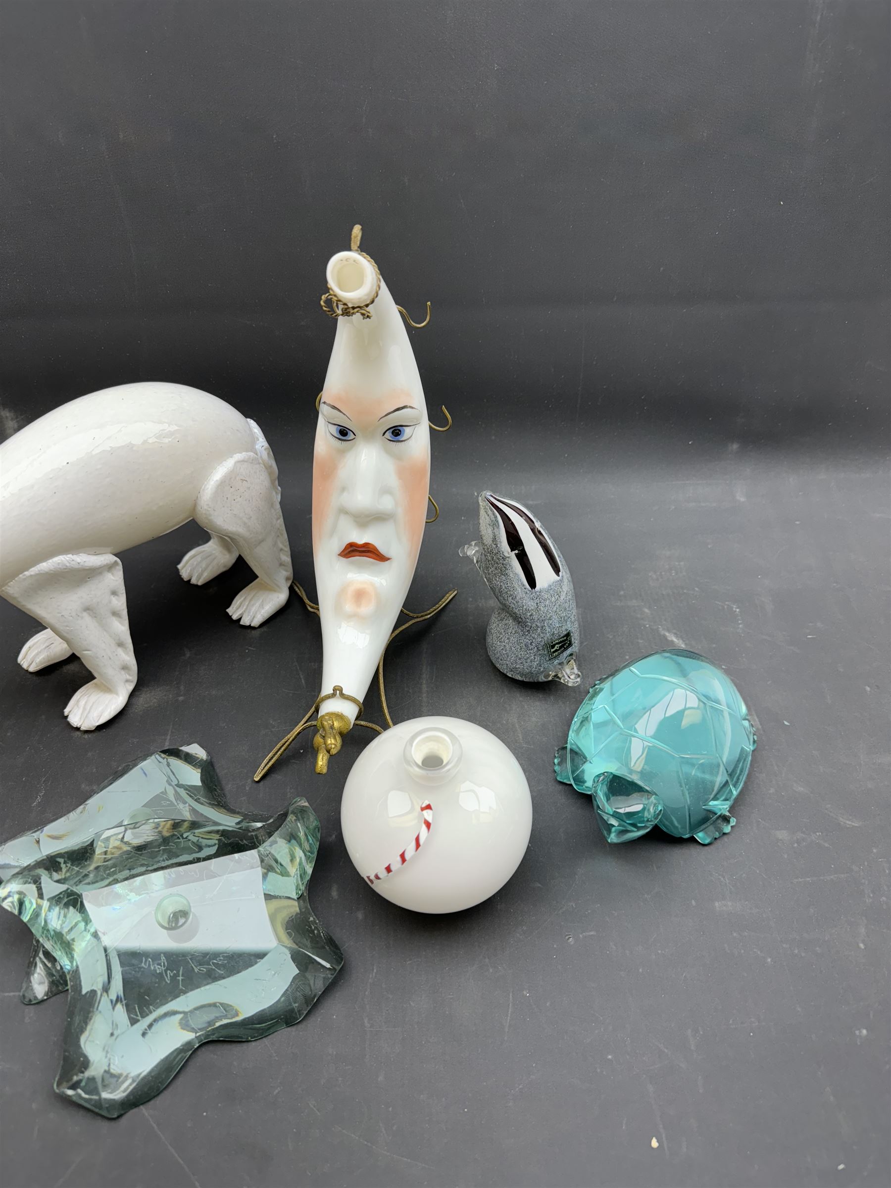 Milk glass decanter, modelled as a moon with a painted face, together with glass animals modelled as a polar bear, turtle and badger, together with other glass  