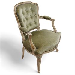 Louis XV design open armchair, white painted and parcel-gilt frame decorated with with painted floral patterns, upholstered in buttoned olive green fabric