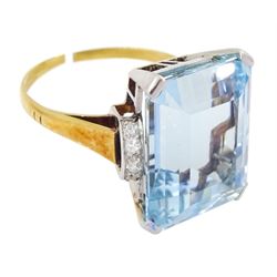 18ct gold single stone emerald cut aquamarine ring, with four channel set diamonds set either side, aquamarine approx 11.15 carat