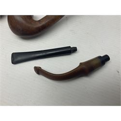 Collection of smoking pipes including Meerschaum pipe, carved as a female head, Briars and clay examples, etc and four pipe racks/stands