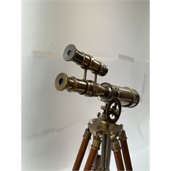 Brass telescope upon a wooden adjustable tripod, H55cm 