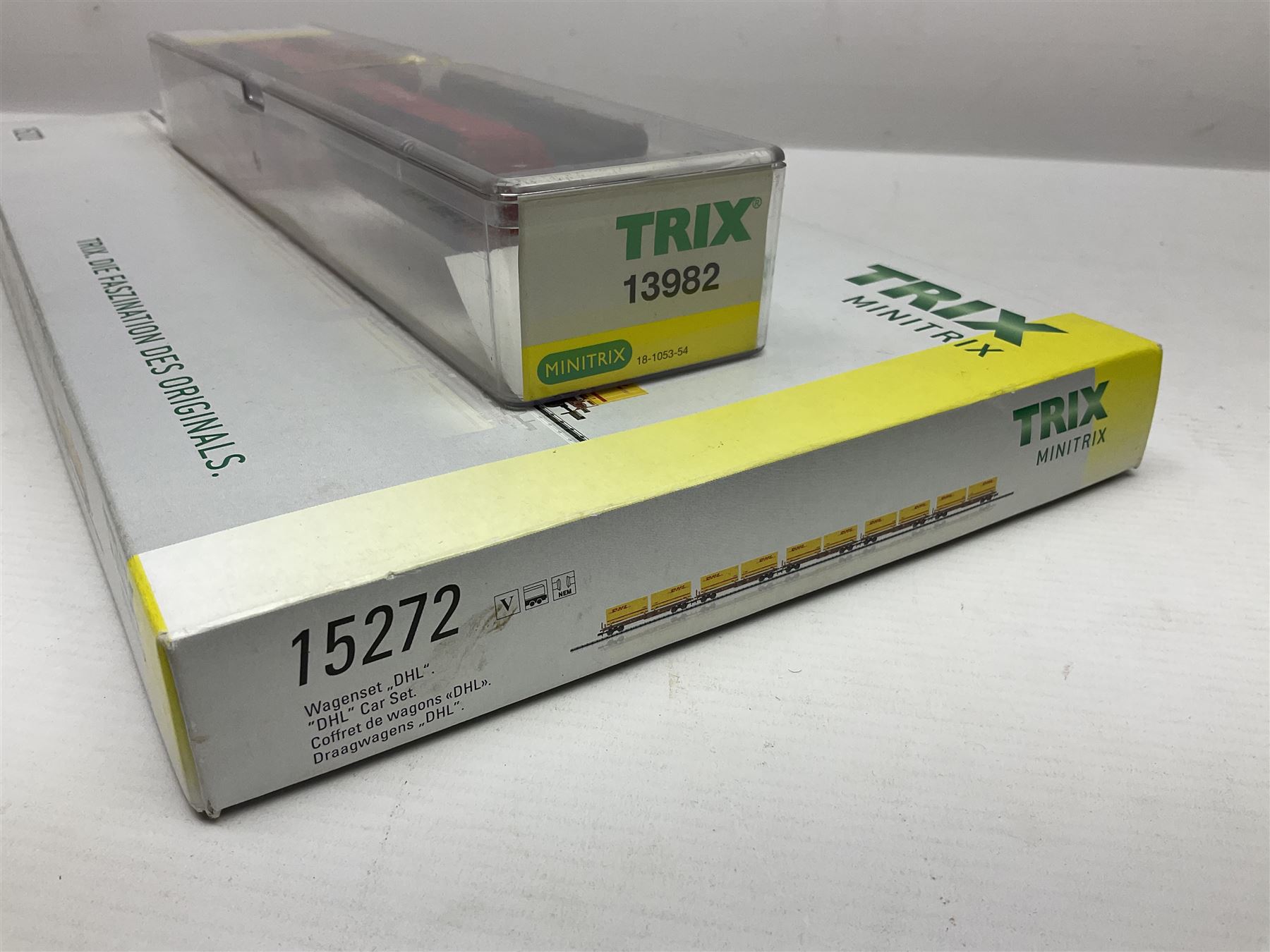 Trix Minitrix 'N' gauge - No.15272 DHL five-car set; boxed; and No.13982 set of three Cargo goods wagons; boxed (2)