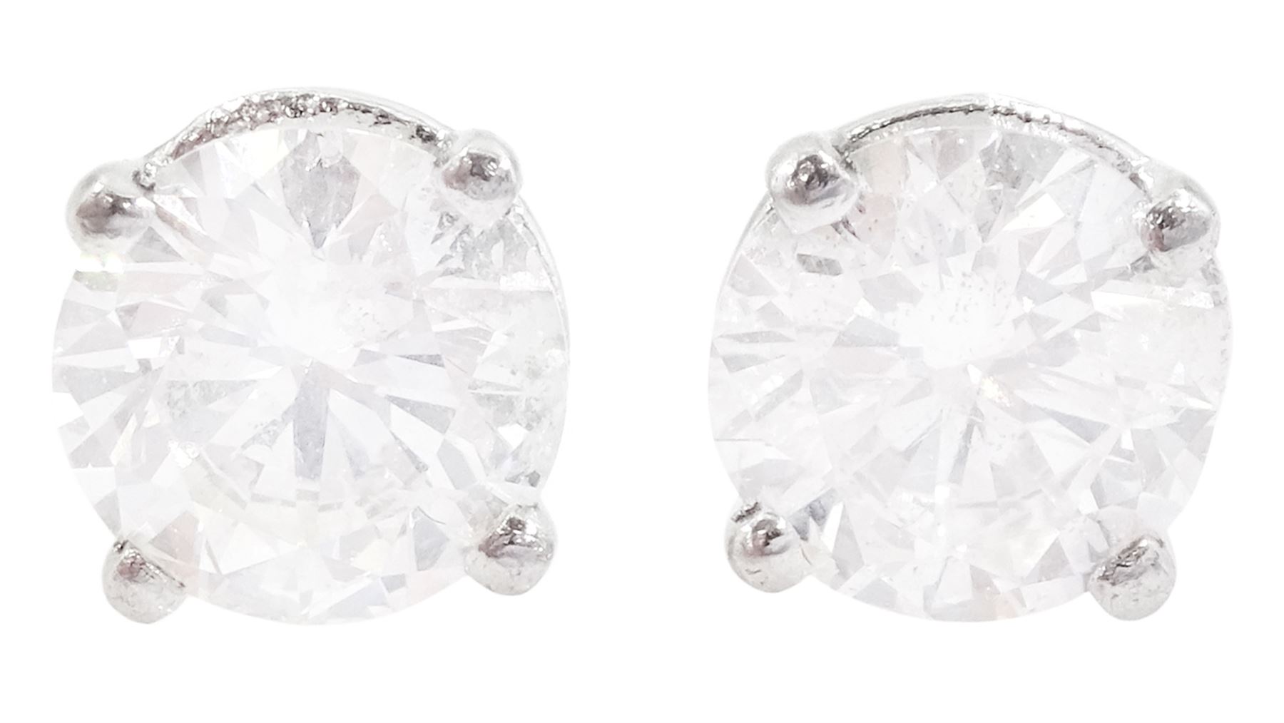 Pair of platinum round brilliant cut diamond stud earrings, hallmarked, total diamond weight approx 1.40 carat