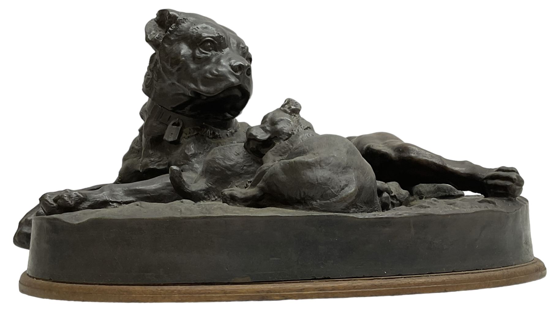 After W. Wolfe; bronze cast figural group depicting bullmastiff feeding puppies, signed with impressed mark to the front, on oval wooden base, H20cm