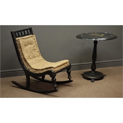  Late Victorian ebonised rocking chair with carved detail and a 19th century black lacquered papier mache occasional table, floral painted shaped tilt top  