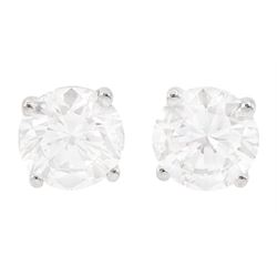 Pair of 18ct white gold round brilliant cut diamond stud earrings, stamped, total diamond ...