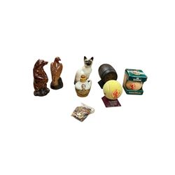 Six whisky miniatures in novelty decanters, together with Beswick cat, and nine Robertsons Golly badges