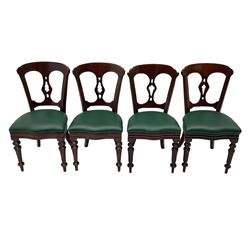 Matched set of twelve Victorian mahogany dining or boardroom chairs, the shaped cresting rail decorated with scrolled decoration, upholstered drop-on seats upholstered in green fabric, on turned supports  