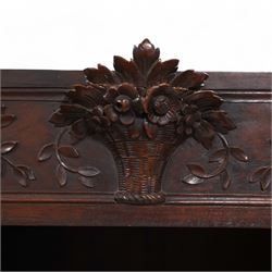 19th century French walnut hall cupboard, the frieze carved with a bouquet of flowers and trailing foliate decoration, enclosed by single panelled door over single drawer, the curved outer corners decorated with trailing leafy branches and flower heads, shaped apron with scroll carved cabriole feet 