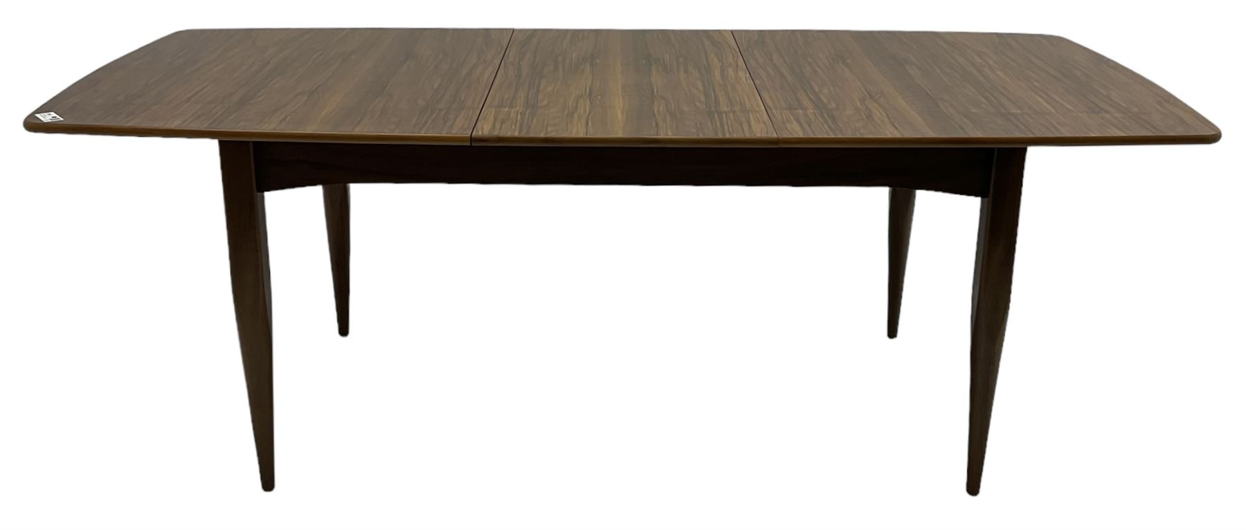 Mid-20th century figured walnut extending dining table, pull-out action with fold-out leaf, on tapering supports 