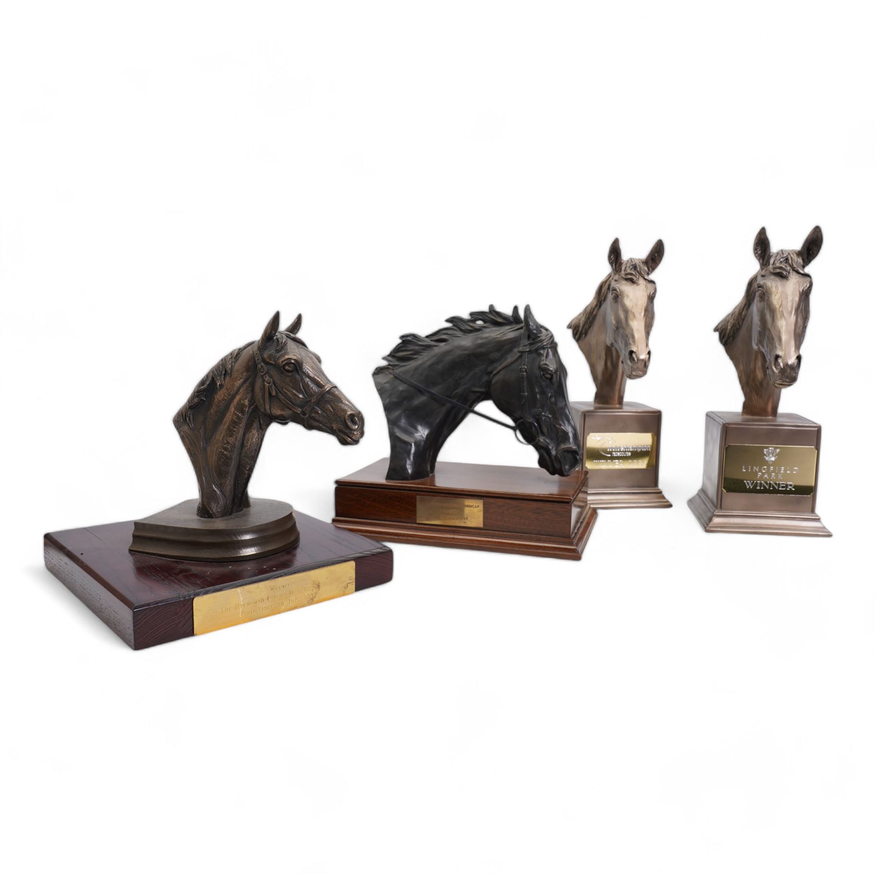 'Winner The Harworth Estates Handicap Stakes, Pontefract 8th July 2008' - Bronzed resin horses head by Doris Lindsey on wooden base 21cm x 20cm , another 'Tote Scoop6 6th November 1999, signed with initials 'CD' and two others (4) 