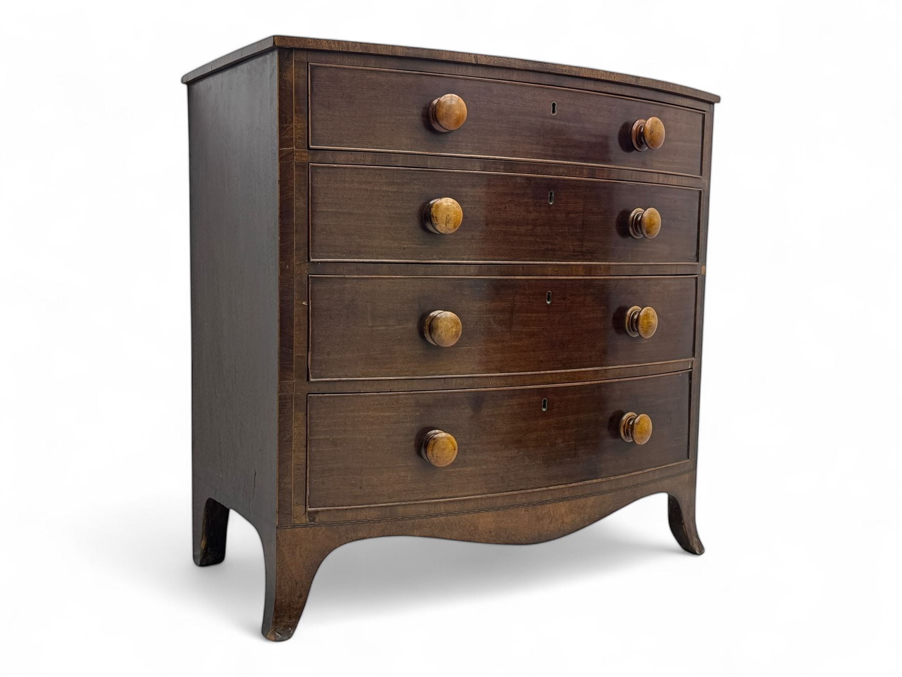 Victorian mahogany bow-fronted chest, fitted with four long graduating cock-beaded drawers, shaped apron on splayed bracket feet