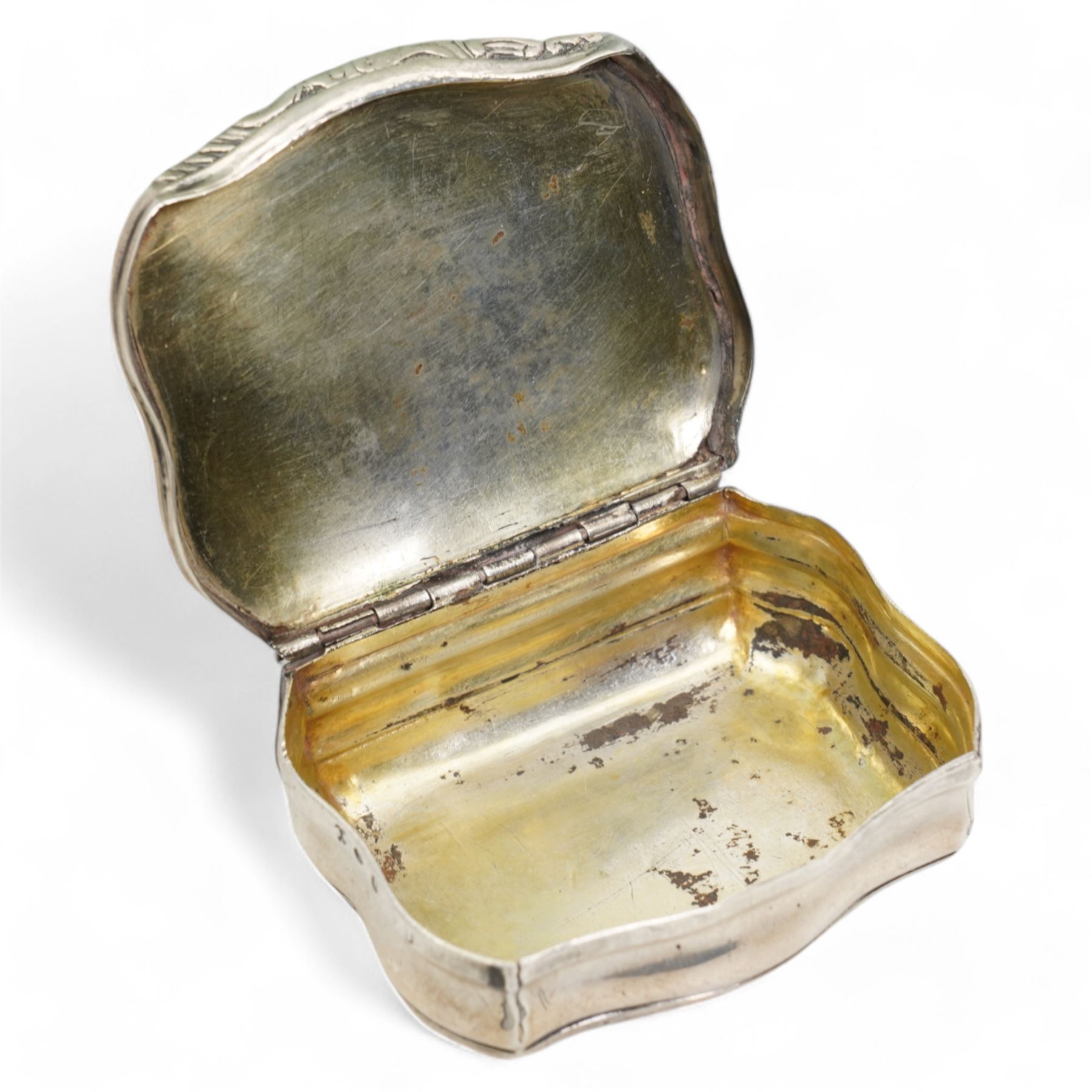 18th century Swedish silver snuff box of serpentine outline, the hinged cover with embossed classical figures, the base engraved 'Anno 1750' and with initials W7cm