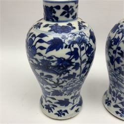 Pair of late 19th/early 20th century Chinese blue and white vases, each of baluster form, painted with dragons amidst flowers, each with Kangxi character marks beneath, H14cm 