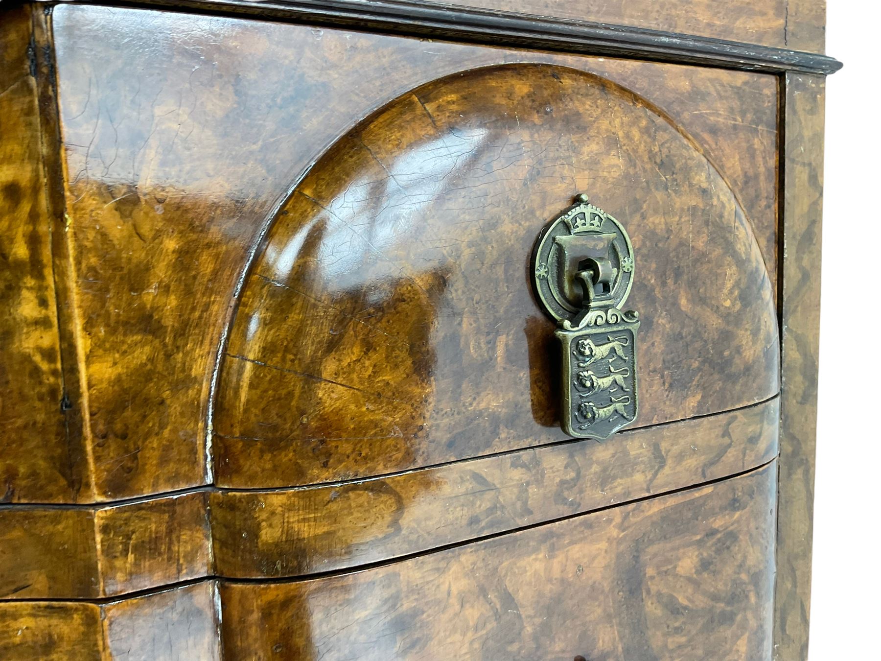 Early to mid-20th century figured walnut chest on stand, four graduating drawers on stand fitted with single drawer, drop handles in the form of shields with three recumbent lions, on cabriole supports