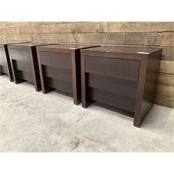 Four rosewood bedside chests, fitted with three stepped soft-close drawers