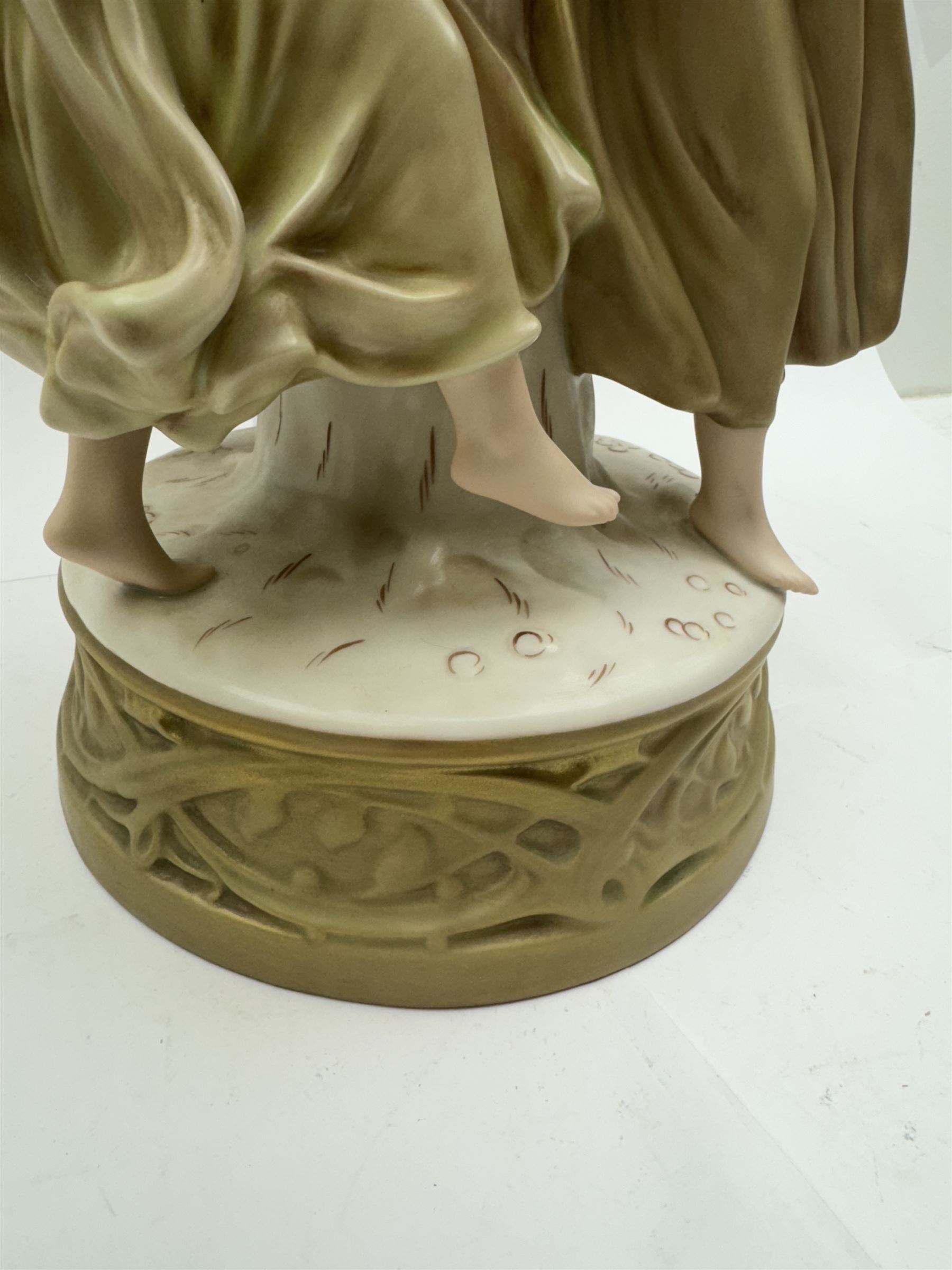 Royal Dux centrepiece, modelled as the Three Graces beneath a floral compote, upon a circular base, H51cm